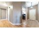 Neutral hallway featuring light wood floors, white doors, and access to rooms at 812 Rio Poco Ct, Henderson, NV 89015