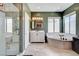 Beautiful bathroom featuring a walk-in shower, soaking tub, and double vanity at 8212 Swallow Falls St, North Las Vegas, NV 89085