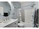 Bathroom features a sink and vanity, a toilet, and a shower-tub combo with a shower curtain at 8212 Swallow Falls St, North Las Vegas, NV 89085