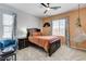 Bright bedroom with stylish decor, a large bed, and a unique hammock chair creates relaxation at 8212 Swallow Falls St, North Las Vegas, NV 89085