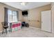Multi-purpose bedroom with storage and table, perfect for workout area with space for a TV at 8212 Swallow Falls St, North Las Vegas, NV 89085