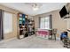 Versatile bedroom with natural light, shelving, and space for fitness, play, and activities at 8212 Swallow Falls St, North Las Vegas, NV 89085