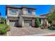 Attractive two-story home with a three-car garage and nicely paved driveway at 8212 Swallow Falls St, North Las Vegas, NV 89085