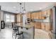 Bright kitchen with granite countertops, stainless appliances, and a breakfast bar with pendant lighting at 8212 Swallow Falls St, North Las Vegas, NV 89085