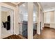 Second floor landing boasts hardwood flooring, decorative banister, and views of additional rooms at 8212 Swallow Falls St, North Las Vegas, NV 89085
