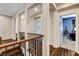 Second floor landing area featuring hardwood flooring, decorative railing, and neutral paint at 8212 Swallow Falls St, North Las Vegas, NV 89085