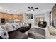 Spacious living area flows into the kitchen, featuring a fireplace and convenient staircase access at 8212 Swallow Falls St, North Las Vegas, NV 89085