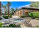 Community spa area featuring lounge chairs, lush landscaping, and a relaxing hot tub at 8212 Swallow Falls St, North Las Vegas, NV 89085