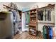 Spacious walk-in closet with custom wood shelving and organizers for optimal storage at 8212 Swallow Falls St, North Las Vegas, NV 89085