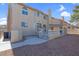 Spacious backyard offering a covered patio, decorative railings, and easy access to the home at 8232 Ocean Terrace Way, Las Vegas, NV 89128