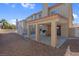 Backyard featuring covered patio area, decorative railings, and ample space for outdoor activities at 8232 Ocean Terrace Way, Las Vegas, NV 89128