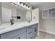 Modern bathroom featuring a double vanity with a marble countertop and stylish fixtures at 8232 Ocean Terrace Way, Las Vegas, NV 89128