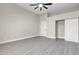 Large bedroom with light gray wood floors and double door closets at 8232 Ocean Terrace Way, Las Vegas, NV 89128