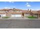 Charming two-story home featuring a three-car garage, red tile roof, and well-maintained landscaping at 8232 Ocean Terrace Way, Las Vegas, NV 89128