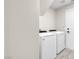 This laundry room has a washer and dryer with access to the garage at 8232 Ocean Terrace Way, Las Vegas, NV 89128
