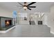 This spacious living room has a fireplace and opens up to the kitchen and staircase at 8232 Ocean Terrace Way, Las Vegas, NV 89128