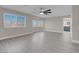 This main bedroom has a ceiling fan, luxury vinyl plank flooring and ample natural light at 8232 Ocean Terrace Way, Las Vegas, NV 89128