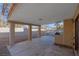 Covered patio with pillars, built-in grill, and a view of the landscaped backyard at 8232 Ocean Terrace Way, Las Vegas, NV 89128