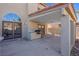 Covered patio featuring built-in grill, recessed lighting, and access to the home's interior at 8232 Ocean Terrace Way, Las Vegas, NV 89128