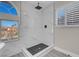 This luxurious walk-in shower features a rainfall shower head and marble surround at 8232 Ocean Terrace Way, Las Vegas, NV 89128