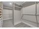 Walk-in closet with custom shelving and ample storage space for clothing and accessories at 8232 Ocean Terrace Way, Las Vegas, NV 89128