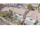 Aerial view of the home showcasing the roof, screened in patio, and surrounding landscaping at 8753 Fountain Island Dr, Las Vegas, NV 89147