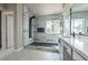 Modern bathroom featuring a glass-enclosed shower with black fixtures and marble-style tile at 8753 Fountain Island Dr, Las Vegas, NV 89147