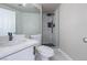 Modern bathroom featuring white marble tile, matte black fixtures, and a glass shower at 8753 Fountain Island Dr, Las Vegas, NV 89147
