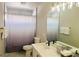 This bathroom features a shower-tub combo, a vanity with a nice mirror, and counterspace at 8753 Fountain Island Dr, Las Vegas, NV 89147