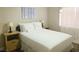 Comfortable bedroom with a neatly made bed, side tables, and soft lighting at 8753 Fountain Island Dr, Las Vegas, NV 89147