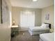 Bright bedroom with two twin beds, a writing desk, and modern décor at 8753 Fountain Island Dr, Las Vegas, NV 89147