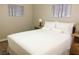 Bedroom featuring a queen-sized bed, neutral walls and abstract style artwork on walls at 8753 Fountain Island Dr, Las Vegas, NV 89147