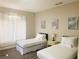 Comfortable bedroom featuring twin beds, neutral tones, and soft natural lighting at 8753 Fountain Island Dr, Las Vegas, NV 89147