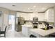 Modern kitchen featuring white cabinets, stainless steel appliances, and a center island with a breakfast bar at 8753 Fountain Island Dr, Las Vegas, NV 89147