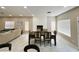 Spacious living room with a fireplace, modern lighting, and an elegant dining set at 8753 Fountain Island Dr, Las Vegas, NV 89147