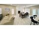 Comfortable living room with ample natural light, a fireplace, and dining area at 8753 Fountain Island Dr, Las Vegas, NV 89147