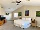 Large main bedroom with vaulted ceiling, ceiling fan, and ample natural light at 8753 Fountain Island Dr, Las Vegas, NV 89147