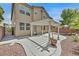 Backyard with a covered patio and minimal landscaping at 9009 Ochoa St, Las Vegas, NV 89143