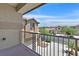 Balcony view showing nearby houses and a blue sky with white clouds at 9009 Ochoa St, Las Vegas, NV 89143