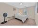 Neutral bedroom with carpet, window and a fan in the corner at 9009 Ochoa St, Las Vegas, NV 89143