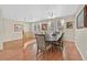 Formal dining room featuring a large table, wood floors, and a stylish chandelier at 9009 Ochoa St, Las Vegas, NV 89143