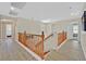 Hallway with light walls and hardwood flooring on the second level at 9009 Ochoa St, Las Vegas, NV 89143