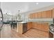 Modern kitchen with stainless steel appliances and a view into the living area at 9009 Ochoa St, Las Vegas, NV 89143