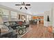 Open-concept living area with a comfortable sectional sofa and a view into the kitchen at 9009 Ochoa St, Las Vegas, NV 89143