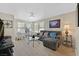 Bright living room with large windows, comfortable seating, and neutral wall color at 9009 Ochoa St, Las Vegas, NV 89143
