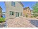 Paver patio in backyard with privacy fence and sliding glass door access to the house at 9198 Rolling Sky Dr, Las Vegas, NV 89178
