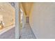 Inviting covered entrance with a neutral color palette, showcasing a tiled walkway leading to the front door at 9198 Rolling Sky Dr, Las Vegas, NV 89178
