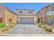 Charming two-story home featuring a gray driveway, neutral exterior, and well-maintained landscaping, providing delightful curb appeal at 9198 Rolling Sky Dr, Las Vegas, NV 89178