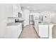 Bright kitchen with white cabinets, stainless steel appliances, granite countertops, and a central island at 9198 Rolling Sky Dr, Las Vegas, NV 89178