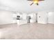 Spacious living area with tile flooring, modern lighting, and an open layout, perfect for entertaining at 9198 Rolling Sky Dr, Las Vegas, NV 89178